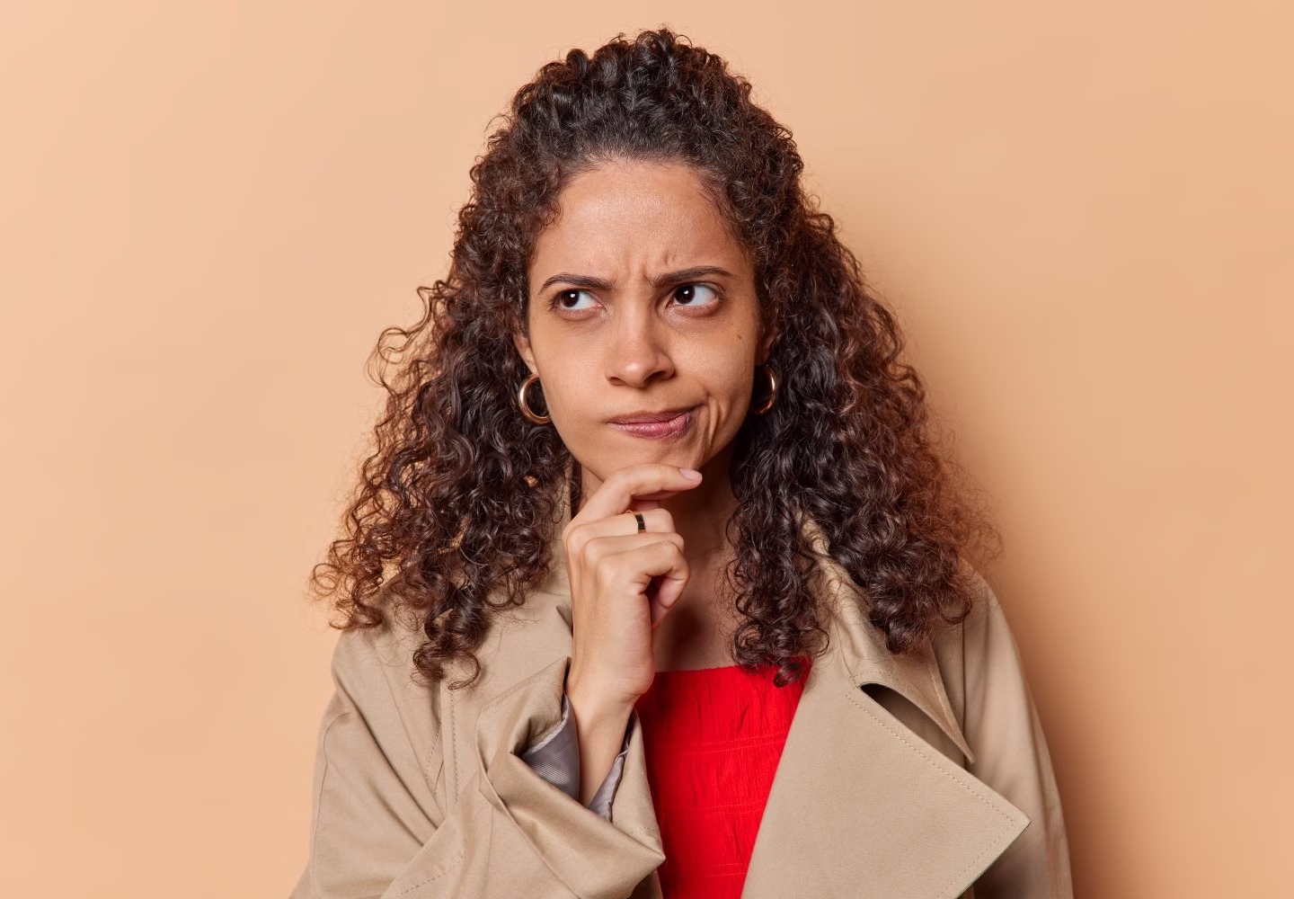 Unsure afro-american woman with pursed lips
